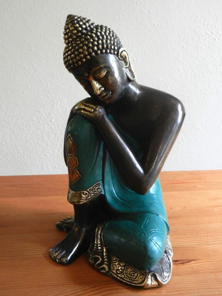 relaxing Buddha in green robe